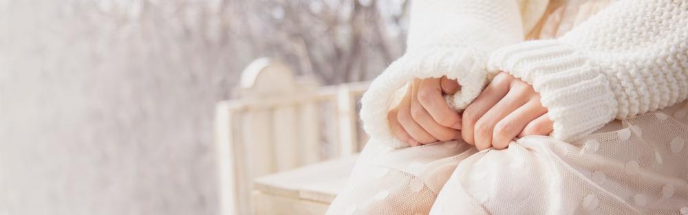 Nervous woman wearing white